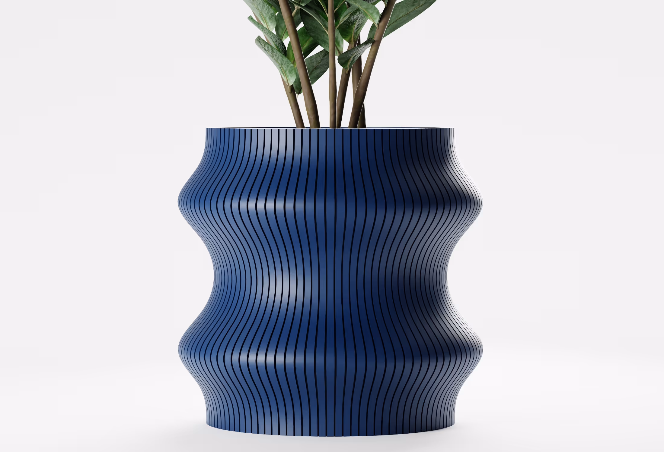 Dark Blue tall wavy planter with vertical ribbed texture, shown front-on with a leafy indoor plant against a light grey background.