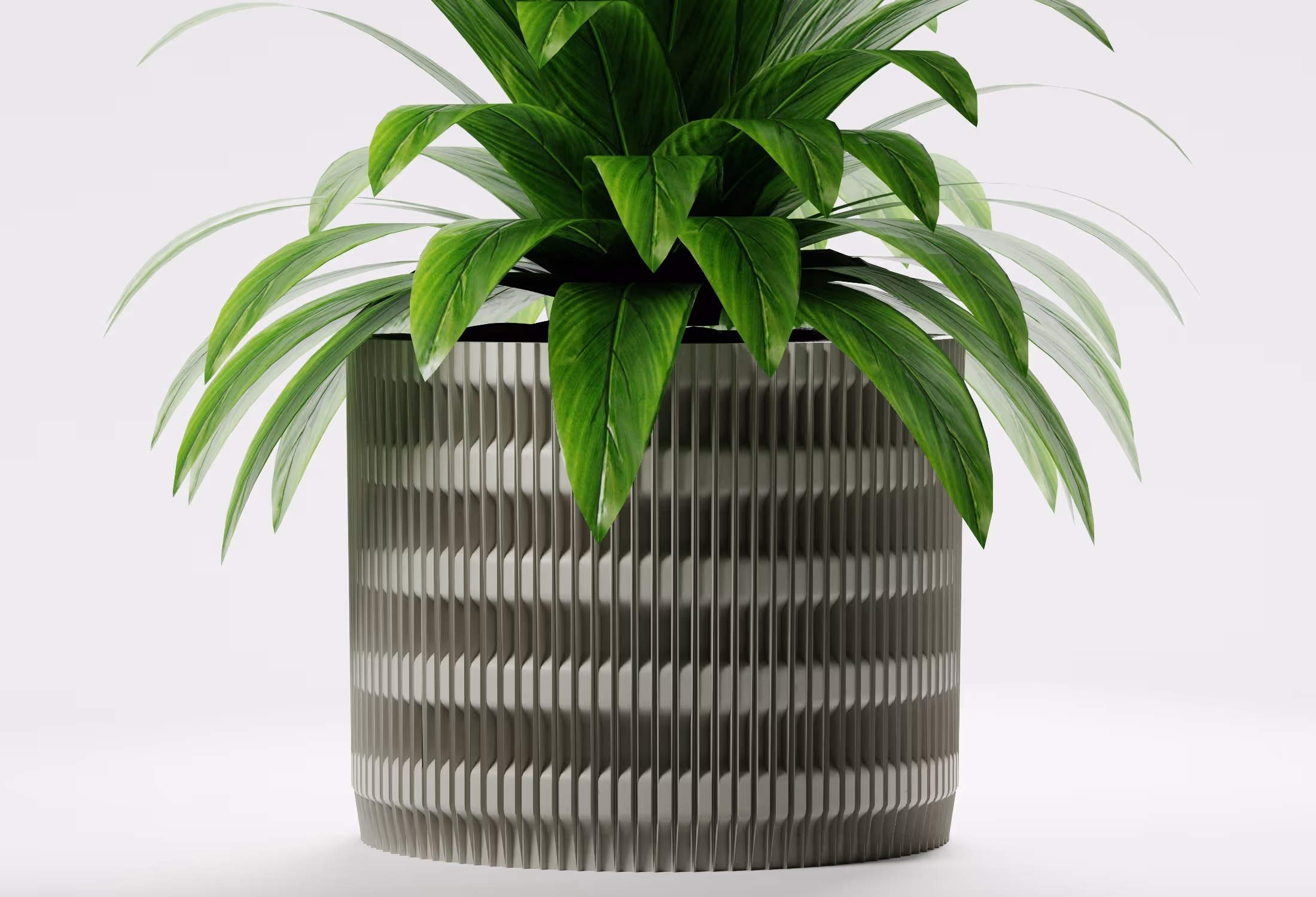 Khaki cylindrical planter with vertical fluted texture and geometric detailing, shown front-on with a leafy indoor plant against a light grey background.