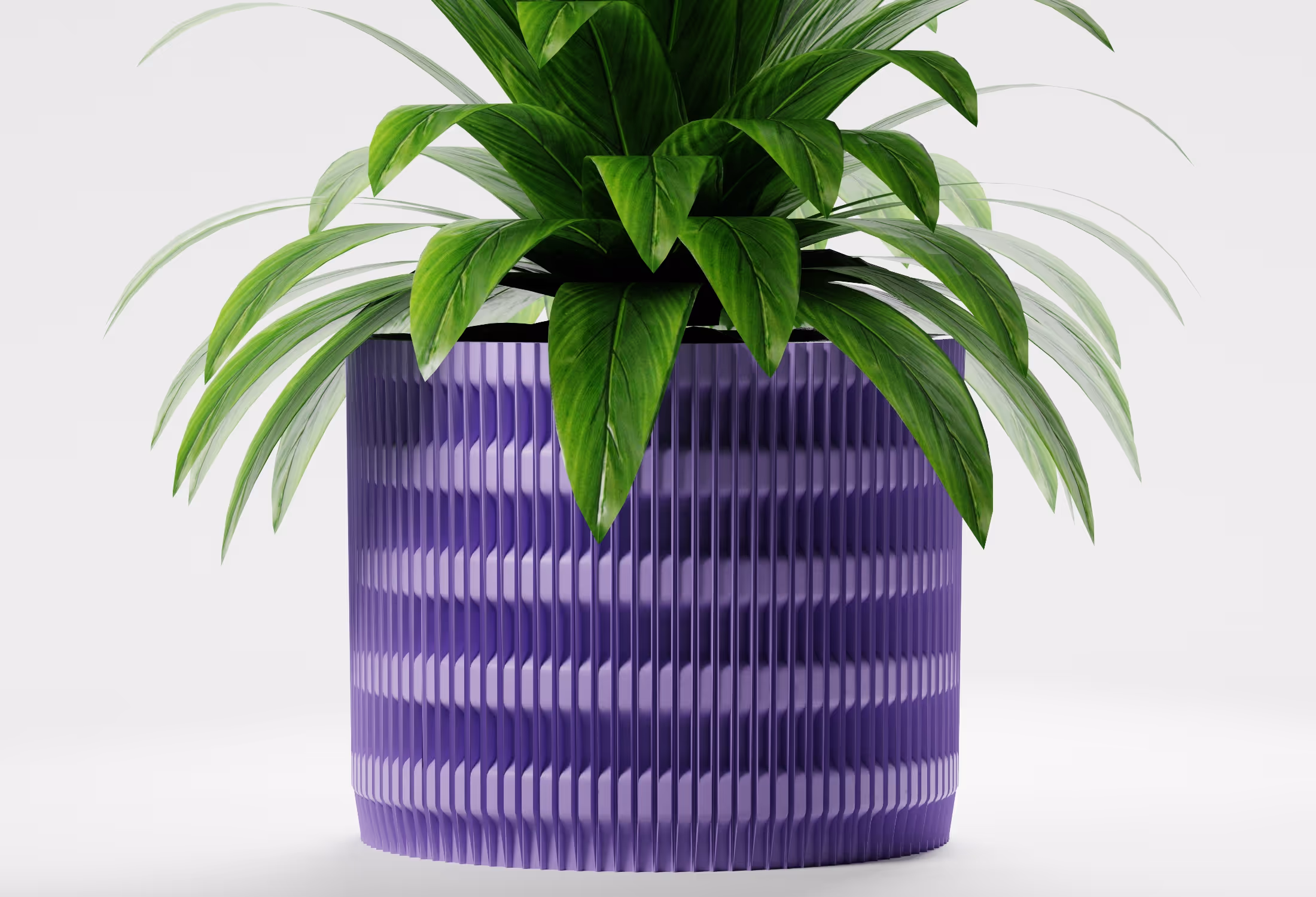 Lilac cylindrical planter with vertical fluted texture and geometric detailing, shown front-on with a leafy indoor plant against a light grey background.