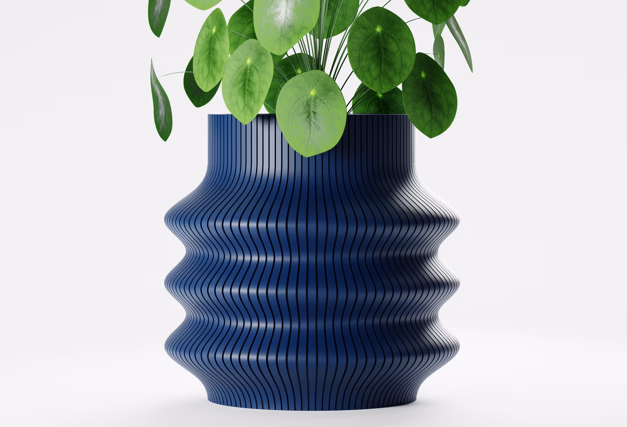 Blue tall wavy planter with flowing vertical ribbed detailing and a sculptural silhouette, shown front-on with a round-leaf indoor plant against a light grey background.