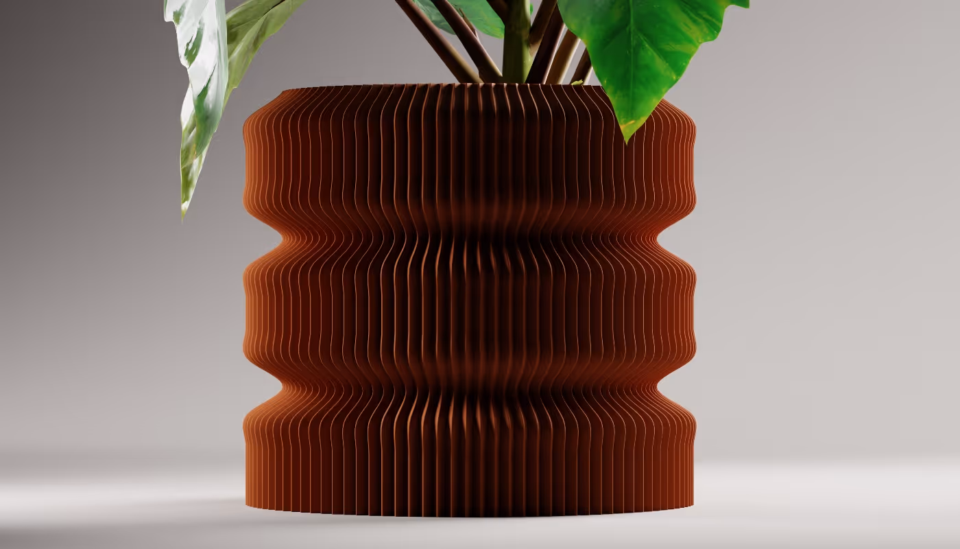 Modern brown ribbed vase holding green leafy plant against a plain background.